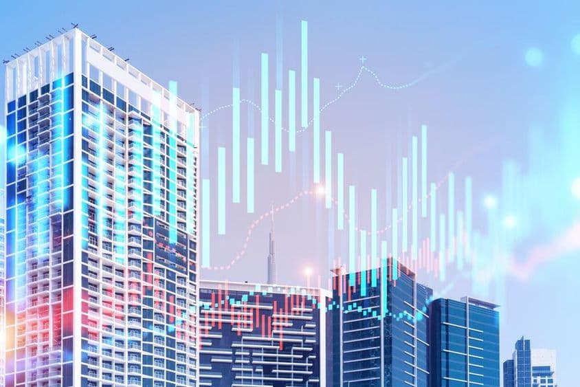 Gebäude mit dem Burj Khalifa im Hintergrund und Diagrammen im Vordergrund.